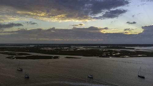 High angle view of beach against sky during sunset