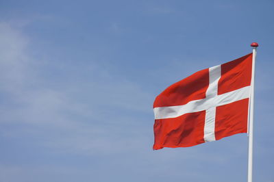 Low angle view of flag against sky