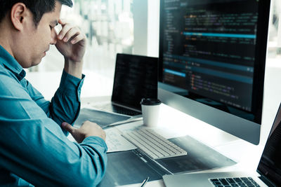 Midsection of man working at office