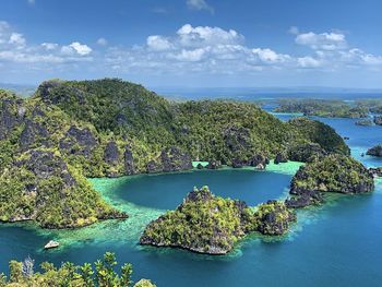 High angle view of sea against sky lagoon in raja ampat archipelago 