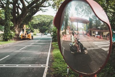 People on road in city