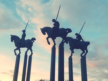 Low angle view of statue against sky