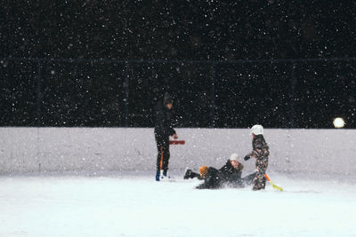 People with dog on snow