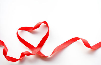 Close-up of heart shape over white background