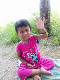 Portrait of smiling girl against plants