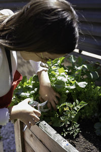 Young woman gardening at yard