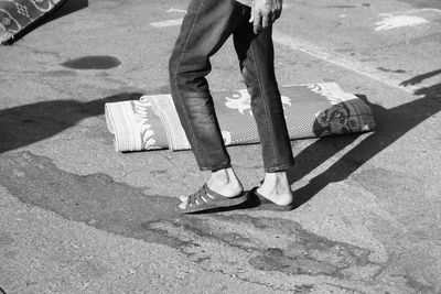 Low section of person walking on street