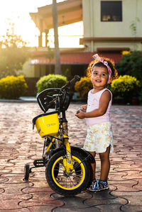 Portrait of cute girl with bicycle