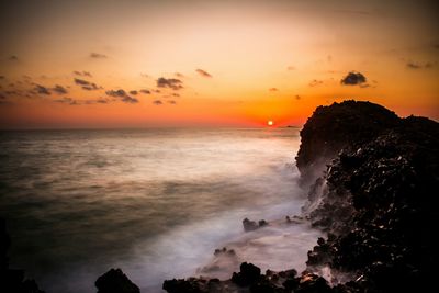 Scenic view of sea at sunset