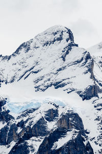 Snow covered mountains against sky