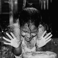 Close-up portrait of girl drinking water