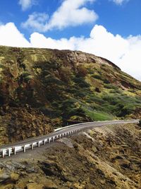 Scenic view of mountain road against sky