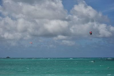 People kiteboarding on sea