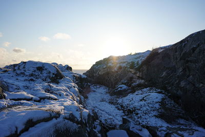 Scenic view of snowcapped mountains against sky during winter