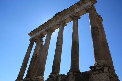 Low angle view of historical building against blue sky