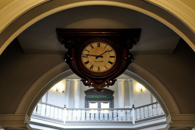 Low angle view of illuminated clock