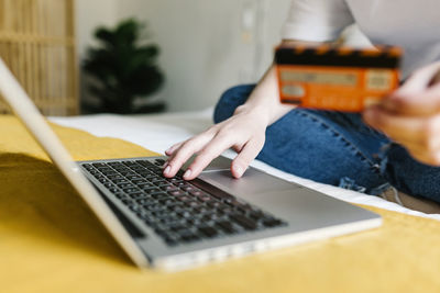 Midsection of woman using mobile phone