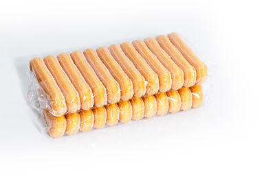 Close-up of bread over white background