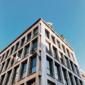 Low angle view of building against clear blue sky