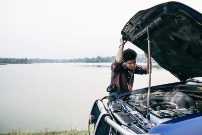 Man repairing car