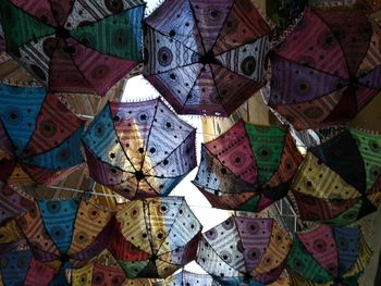 Low angle view of umbrellas hanging on ceiling