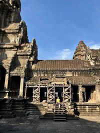 Old temple building against sky