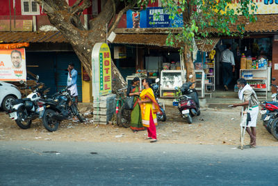 People working on street in city