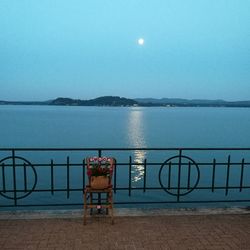 Scenic view of sea against clear sky at night