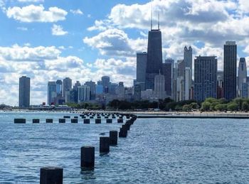 Cityscape against cloudy sky