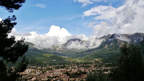 Scenic view of mountains against cloudy sky