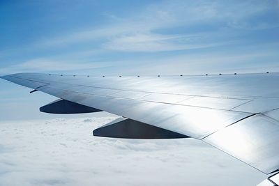 Close-up of airplane flying in sky