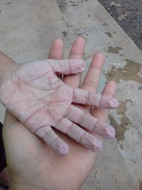 High angle view of hands of baby hand