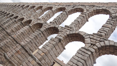 Low angle view of old ruins against sky