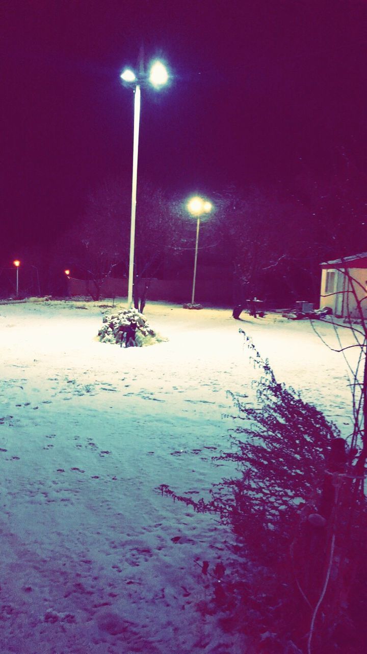 SNOW COVERED FIELD AT NIGHT