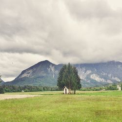 Scenic view of landscape against cloudy sky