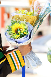 Midsection of woman holding gift