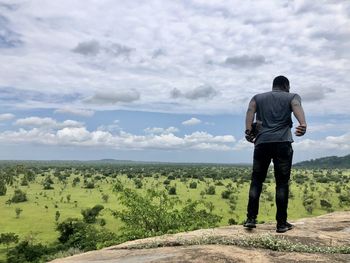 Rear view of man standing on land