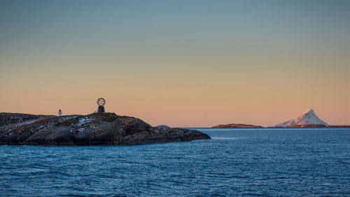 Scenic view of sea against clear sky during sunset