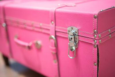 Close-up of pink suitcase