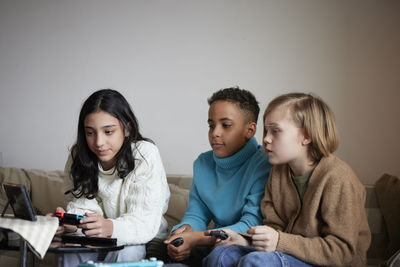 Children playing video games at home