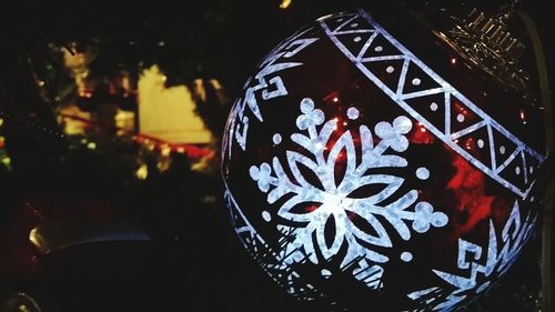 Close-up of christmas decorations at night