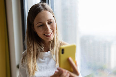 Young woman using mobile phone