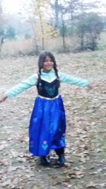 Portrait of happy girl playing in park