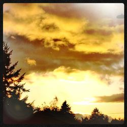 Low angle view of cloudy sky at sunset