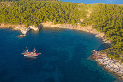 Aerial view of a sailing ship, boat trip in the aegean sea near the coast of thassos island, greece