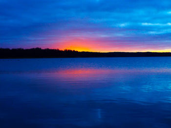 Scenic view of lake at sunset