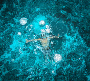 High angle view of man swimming in sea