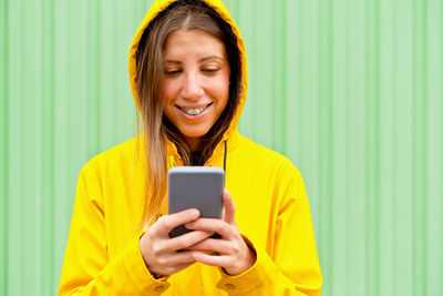 Young woman using mobile phone