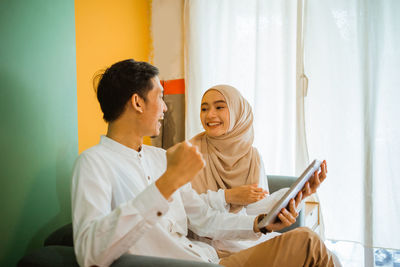 Female doctor examining patient at home