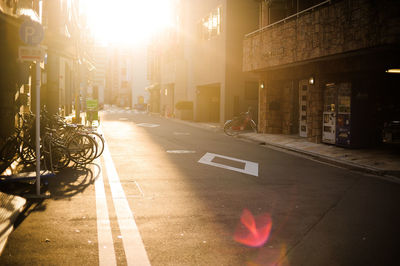 Road amidst city buildings